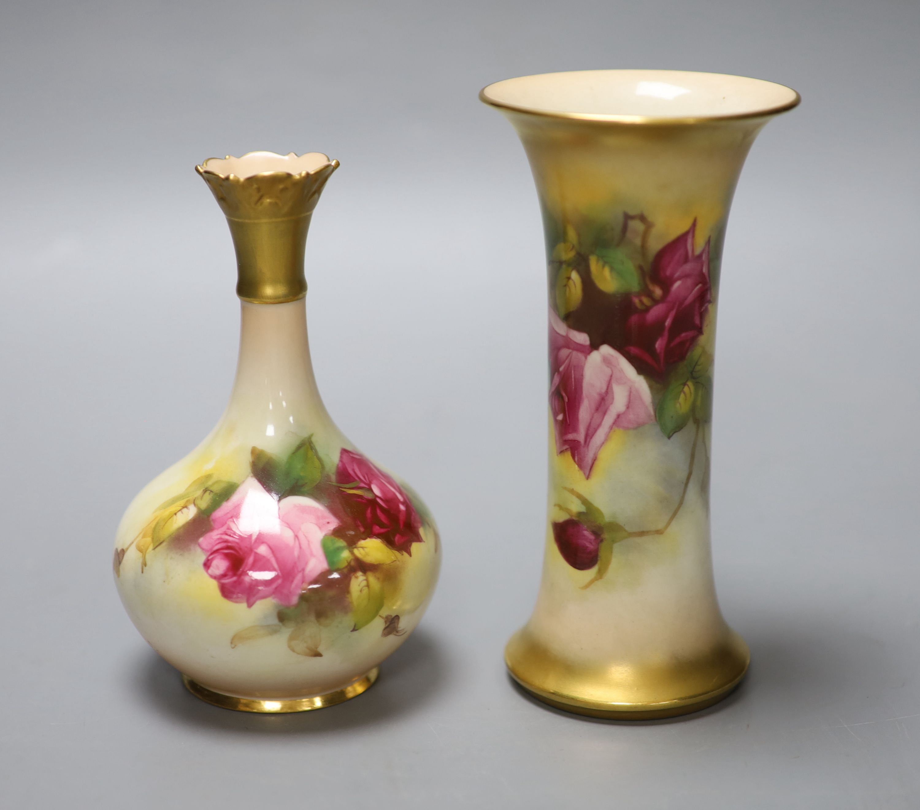 A Royal Worcester trumpet vase, shape G923 painted with roses by M. Hunt, signed, date code 1925 and another vase, shape G702 painted w